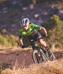 Man riding a mountain bike off road