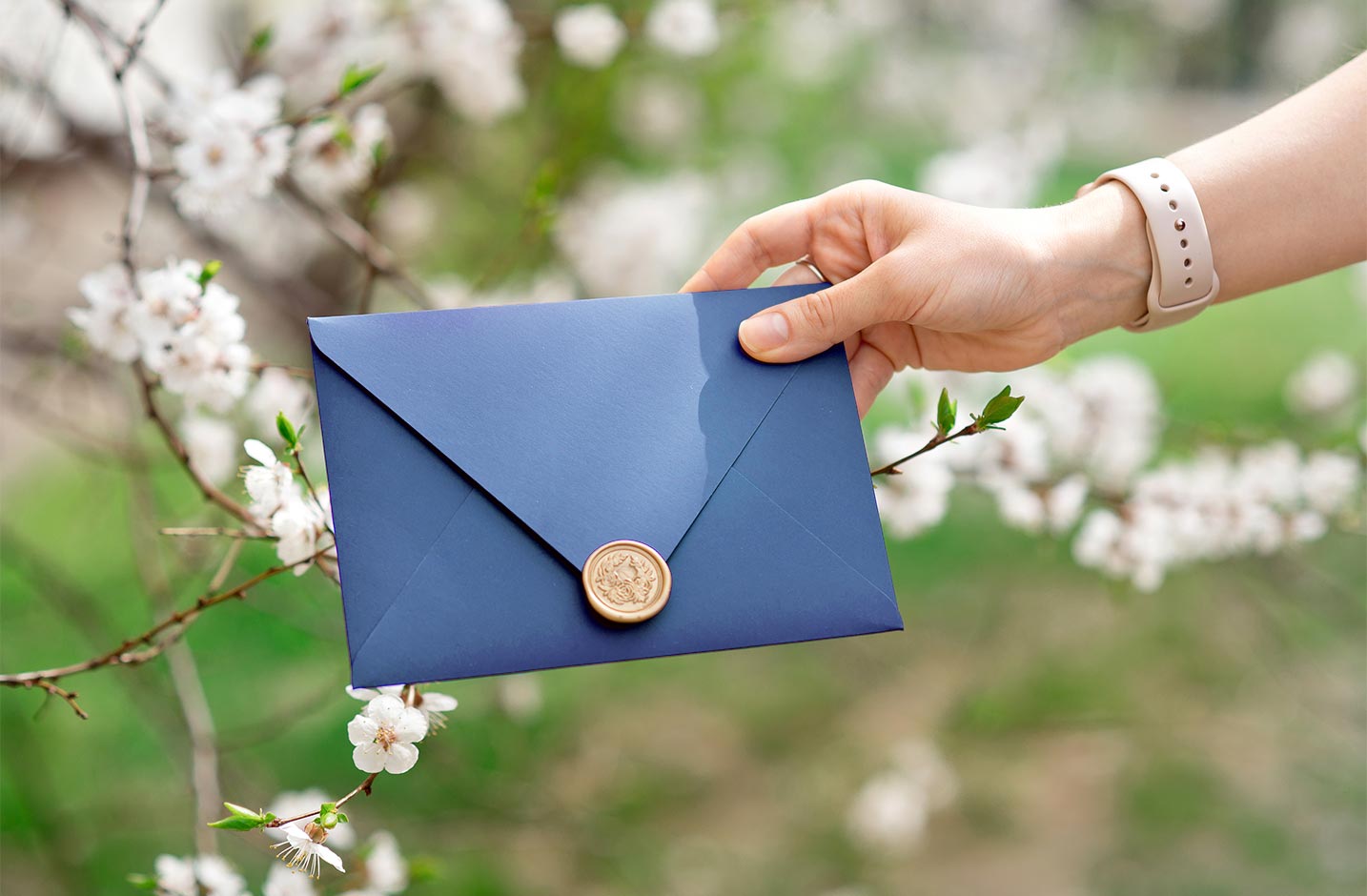 Someone giving a wax sealed envelope