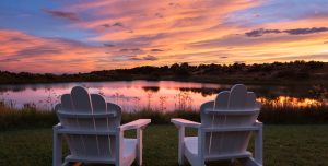 Sunset over Blue Lake with pinks, oranges, and blues in the sky