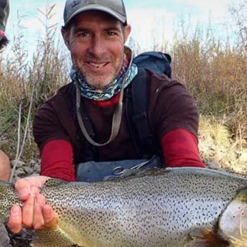 Fisher men holding their prized catch